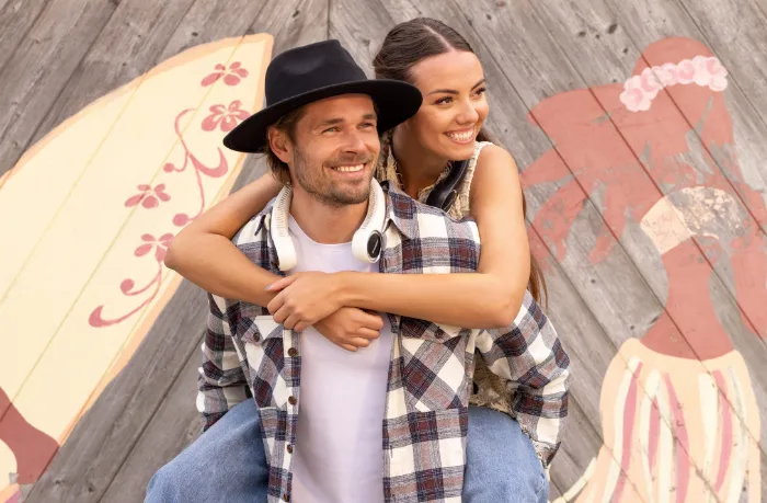 Man and woman enjoying outdoor activities with hands-free neck fans